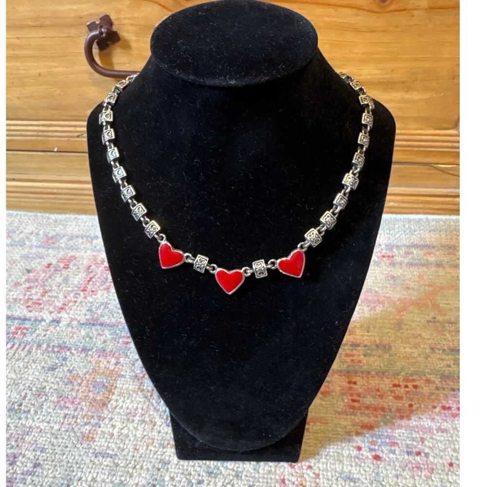 A Premier design, enamel in red and silverplate heart necklace